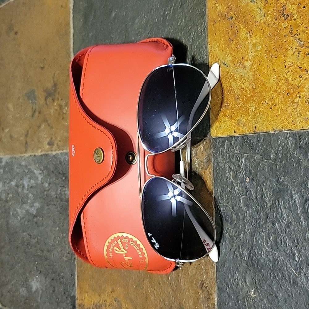 Ray Ban women's aviator sunglasses by Luxottica.